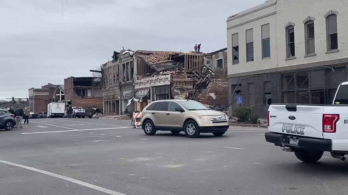 President Biden will be arriving here in Mayfield shortly. We're seeing state police and what I believe are members of the secret service. There's two men standing on top of a half-collapsed building awaiting his arrival