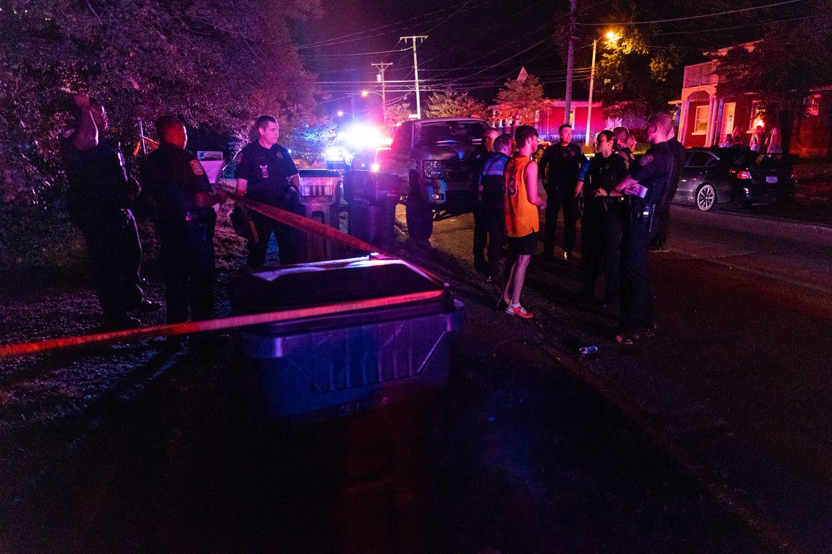 Police work a scene on University Avenue after responding to reports of shots being fired at an off-campus house.