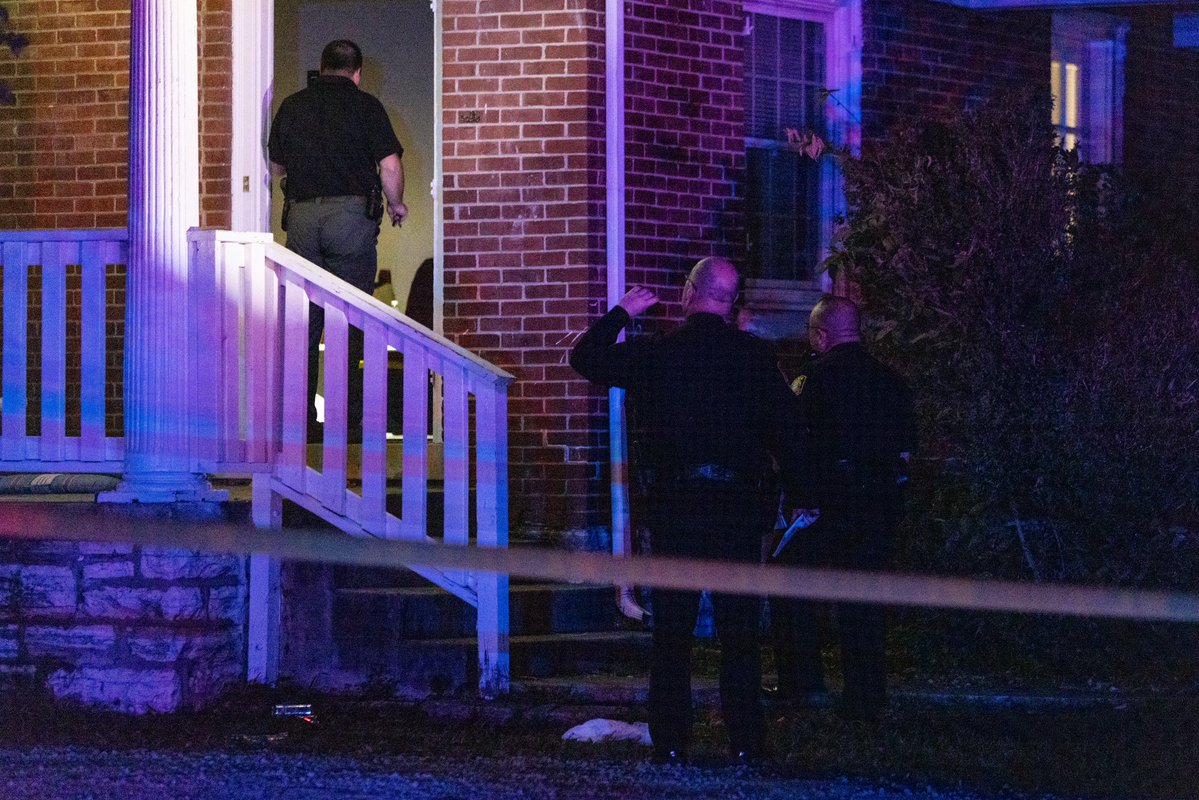 Police work a scene on University Avenue after responding to reports of shots being fired at an off-campus house.